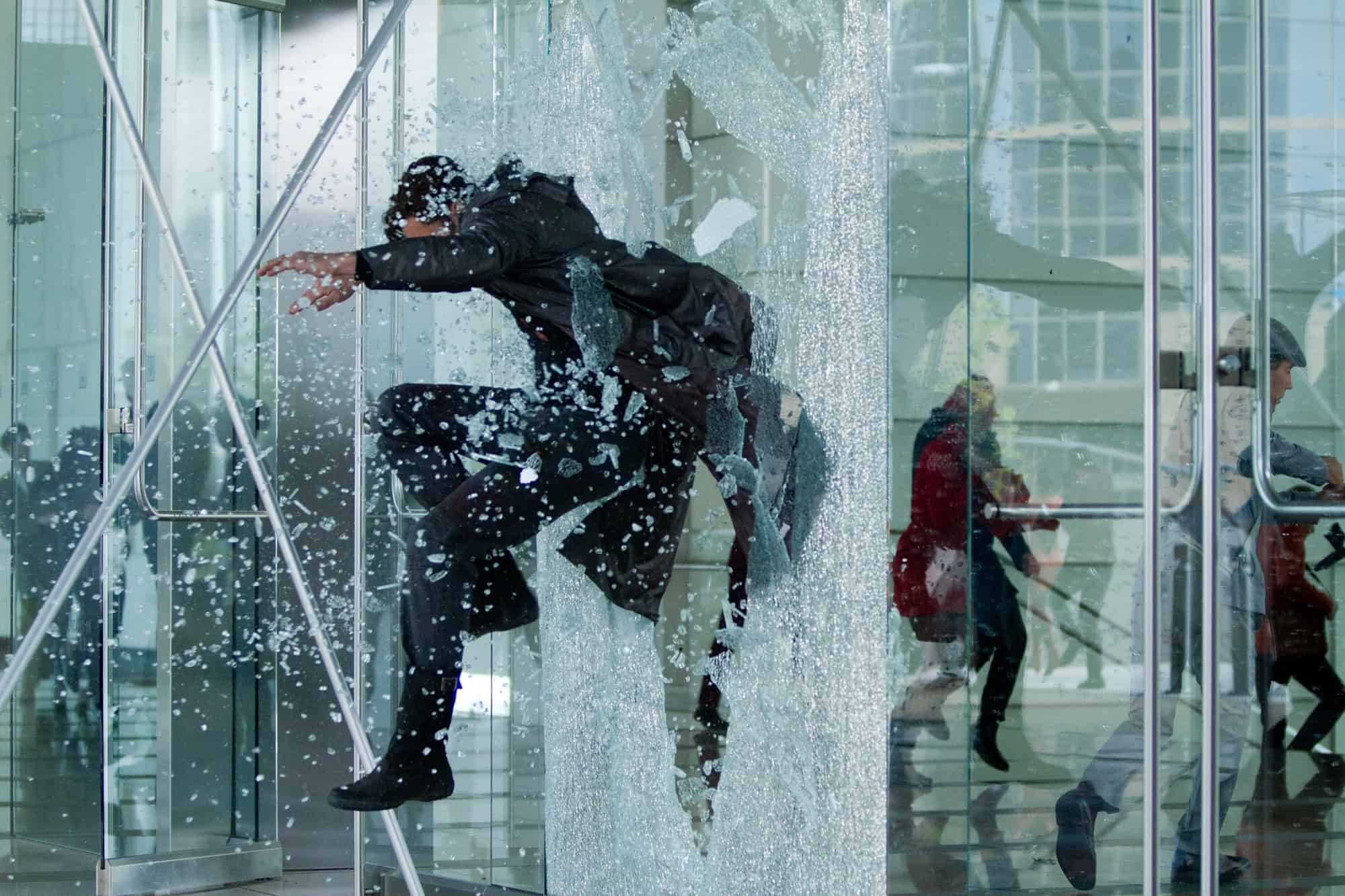 A Random Video Montage Of People Breaking Through Glass In Movies