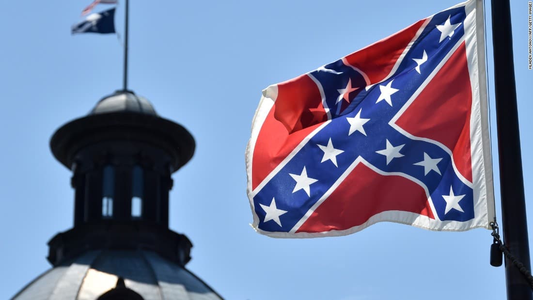 Protester Dives to Take Down Confederate Flag on Live TV