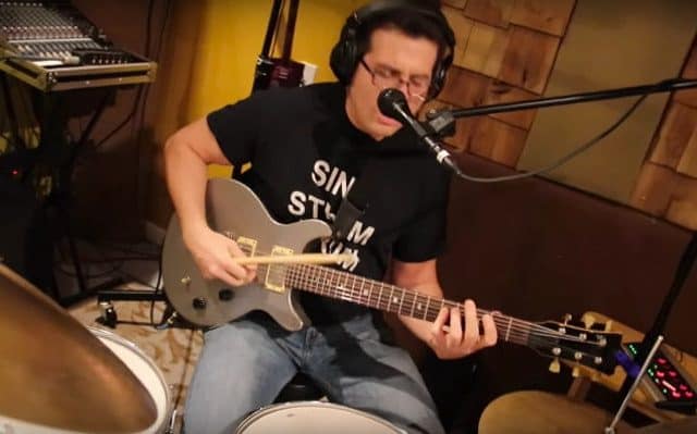 Performing Rush&#8217;s &#8220;Tom Sawyer&#8221; Simultaneously Playing Drums, Guitar, and Singing