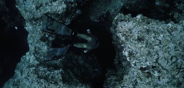 Steadicam Shot of a Free Diver Going Through an Underwater Cave is Amazing