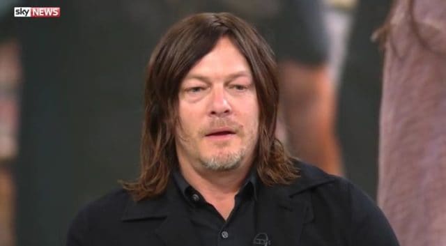 Here&#8217;s Norman Reedus Getting Dragged Off a Live News Broadcast