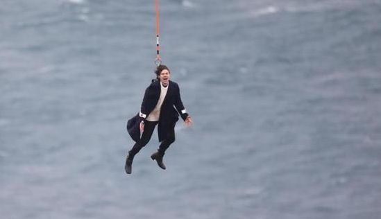 Harry Styles Dangling from a Helicopter Photo Erupts into Internet Photoshop Contest