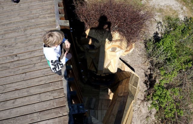 Danish Artist Hide Giants That He Makes From Wood In The Wilderness