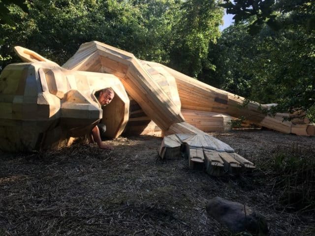 Danish Artist Hide Giants That He Makes From Wood In The Wilderness