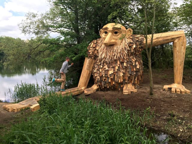 Danish Artist Hide Giants That He Makes From Wood In The Wilderness