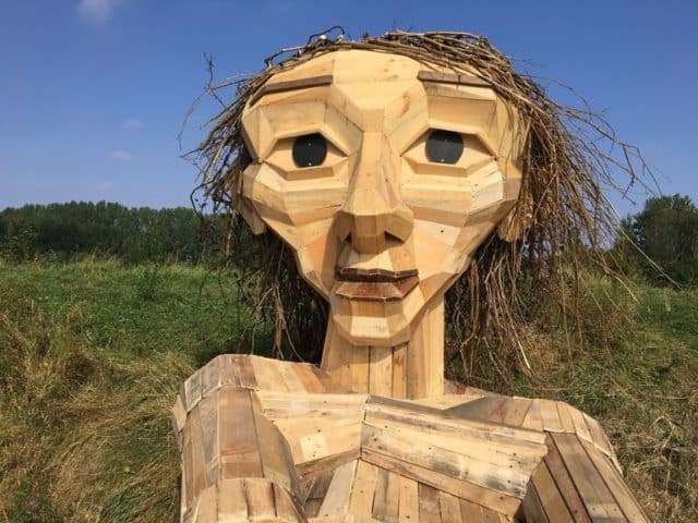 Danish Artist Hide Giants That He Makes From Wood In The Wilderness