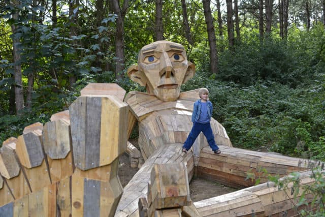 Danish Artist Hide Giants That He Makes From Wood In The Wilderness