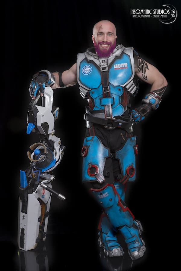 A Bald And Bearded Male Version of Zarya from Overwatch Cosplay