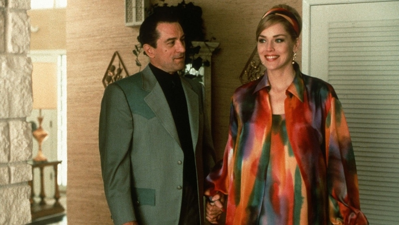 Robert De Niro wearing a suit and Sharon Stone in Casino
