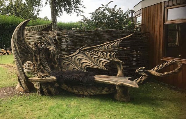 Artist Chainsaw Carves Dragon Bench Out Of Single Piece Of Wood