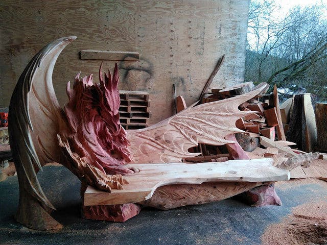 Artist Chainsaw Carves Dragon Bench Out Of Single Piece Of Wood