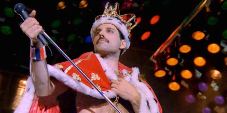 Freddie Mercury performing on stage