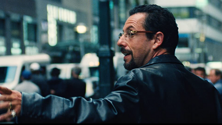 Adam Sandler in Uncut Gems, walking down the street in New York