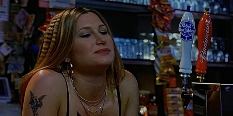 Blonde Kathryn Hahn as a bartender 