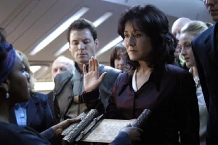 Laura Roslin (Mary McDonnell) being sworn in as President of the Twelve Colonies in Battlestar Galactica