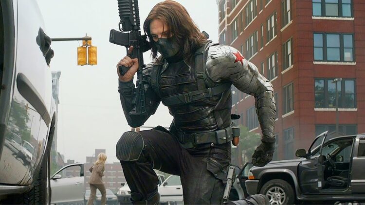 Bucky barnes sitting with a gun in his hands - thunderbolts MCU team members