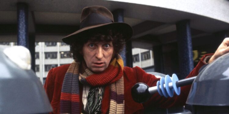 Tom Baker as the Fourth Doctor with Daleks approaching in Doctor Who