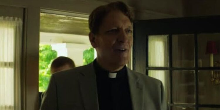 Clancy Brown as Reverend Gospel in Little Evil