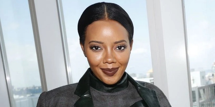 Angela Simmons is a business woman in a suit