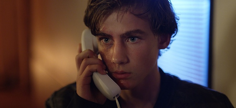 Brady Hepner Taking a call in a movie