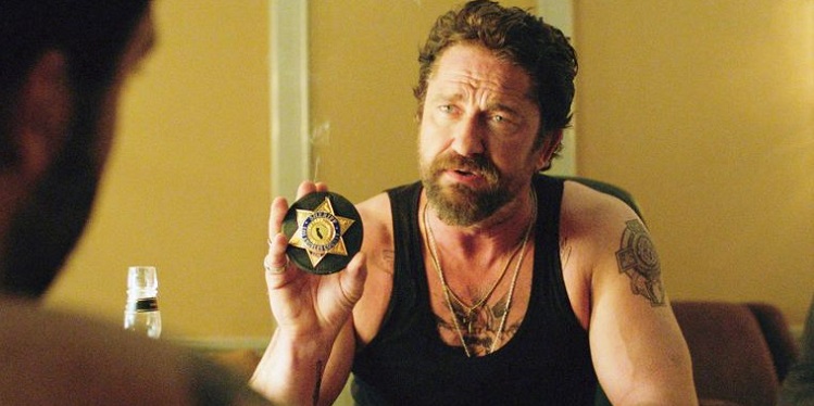 Gerard Butler in a Movie Showing a Badge