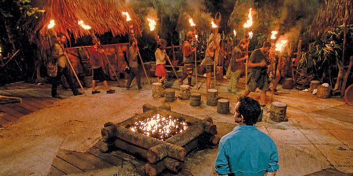 Contestants holding fire in Survivor