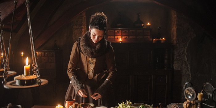 Clair working on herbal remedies in Outlander