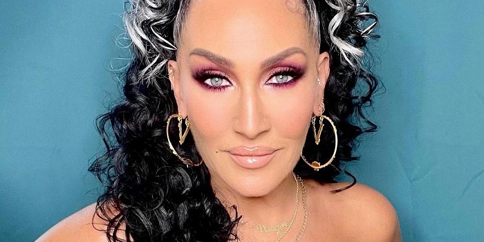 Michelle Visage in purple makeup