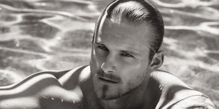 Alexander Ludwig in a swimming pool