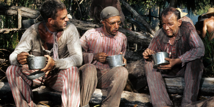 Dustin Hoffman, Steve McQueen, and Woodrow Parfrey in Papillon (1973)