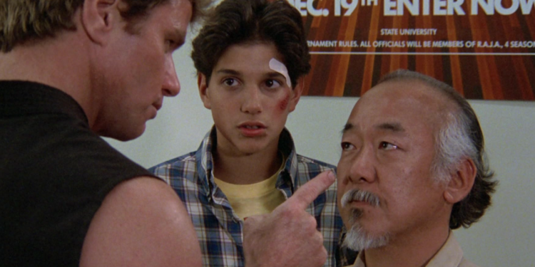 Ralph Macchio, Pat Morita, and Martin Kove in The Karate Kid (1984)