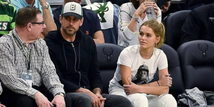 Aaron Rodgers and Mallory Edens watching a game