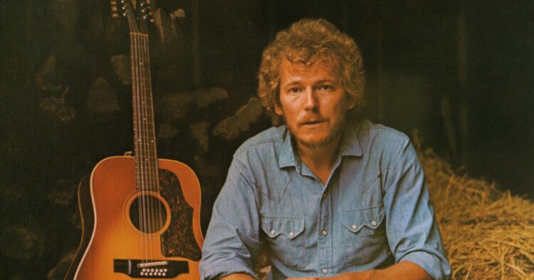 Gordon Lightfoot posing with an acoustic guitar  - Musicians who died in 2023
