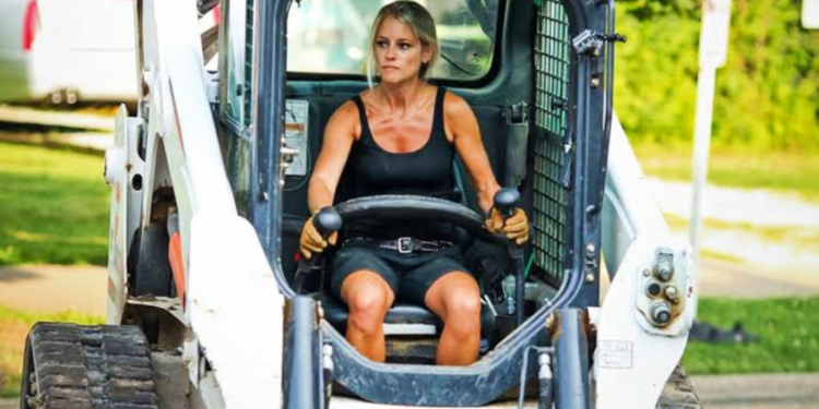 Nicole Curtis in a bulldozer