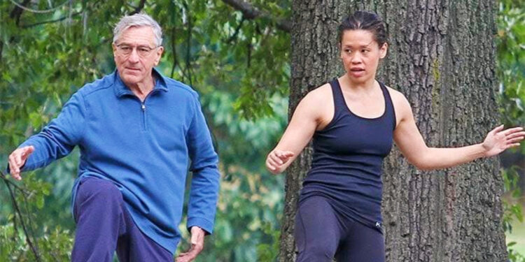 Tiffany Chen and Robert De Niro on The Intern set