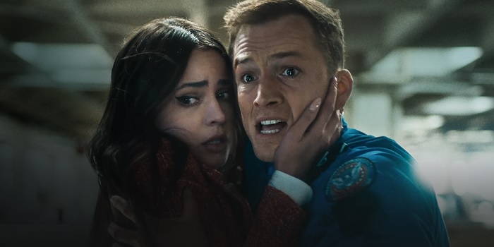 Taron Egerton and Sofia Carson in Carry-On