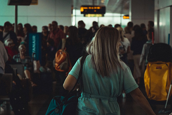 Woman Tries To Survive TSA At 7AM, Gets Ambushed By Rude Mom With Opinions And A Megaphone Kid