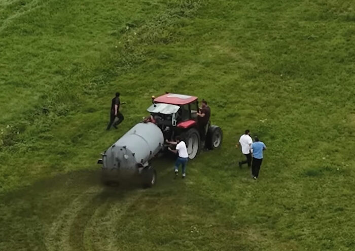 Photographer Reveals The Full Story After Farmer Goes Viral For Spraying Squatters With Manure