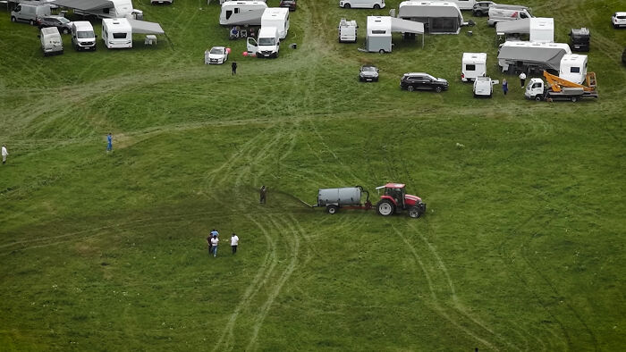 Photographer Reveals The Full Story After Farmer Goes Viral For Spraying Squatters With Manure