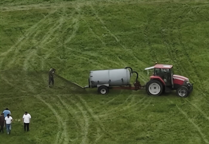 Photographer Reveals The Full Story After Farmer Goes Viral For Spraying Squatters With Manure
