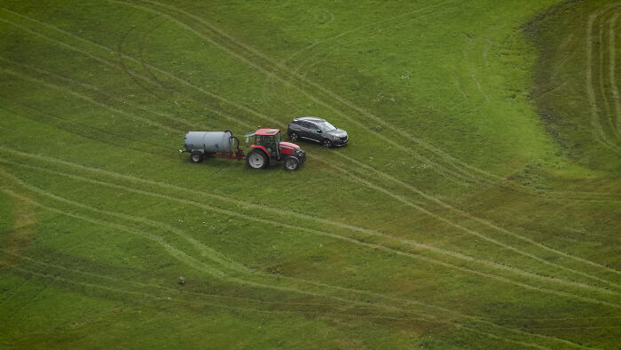 Photographer Reveals The Full Story After Farmer Goes Viral For Spraying Squatters With Manure