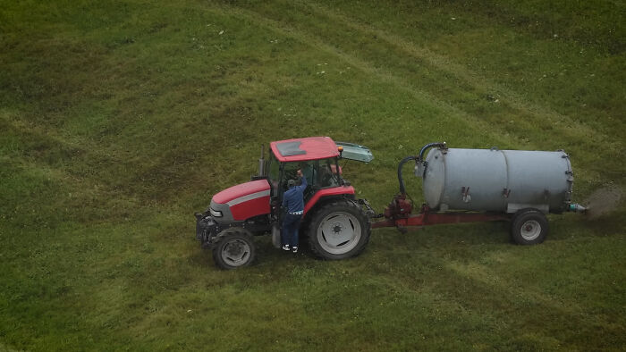 Photographer Reveals The Full Story After Farmer Goes Viral For Spraying Squatters With Manure