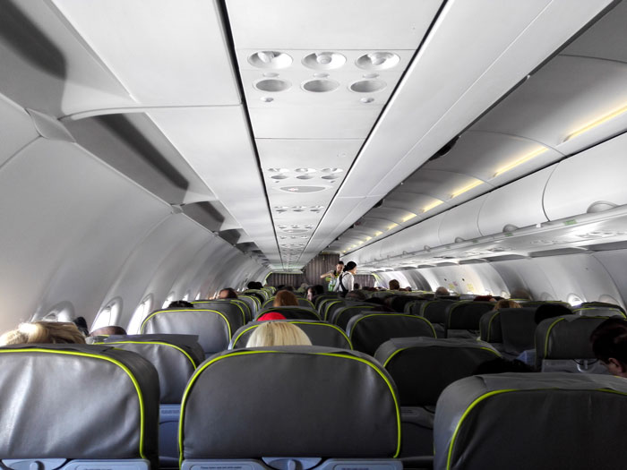 Obese Woman Tries To Force Passenger To Raise Their Armrest, Flight Attendant Has To Get Involved