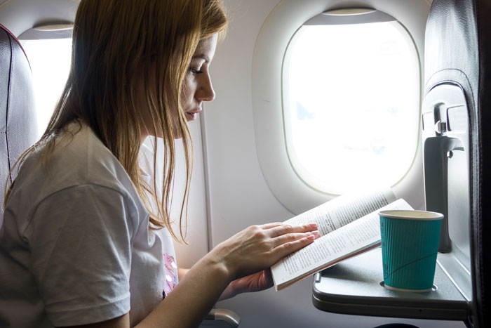 Obese Woman Tries To Force Passenger To Raise Their Armrest, Flight Attendant Has To Get Involved