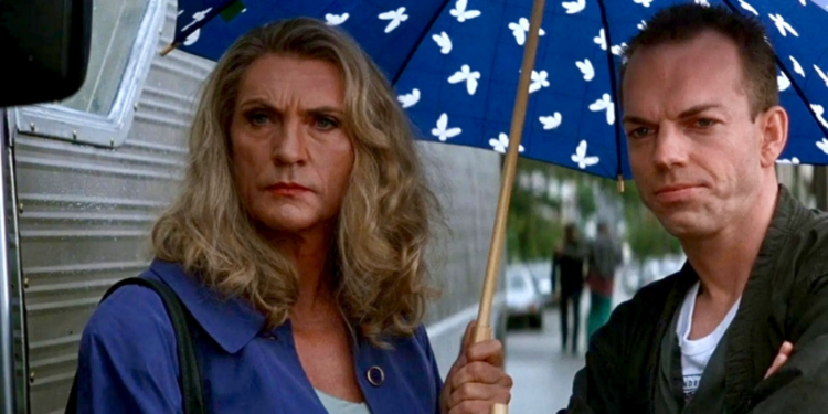 Film still of Bernadette standing in