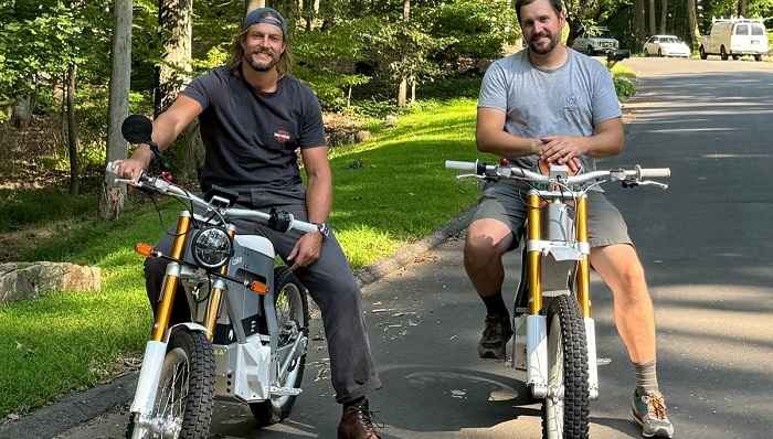 Genat riding a bike with a friend