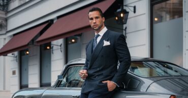Tristan tate Tristan Tate poses for a photo in front of a car