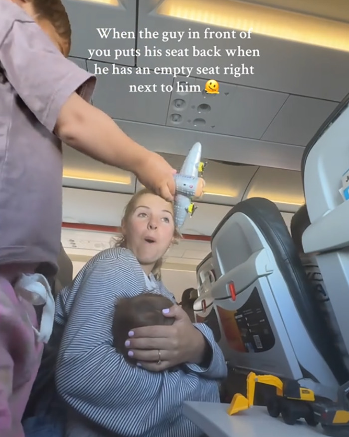 “Buy Another Seat”: Mom Sparks Outrage After Passenger Reclines Seat Into Her Lap