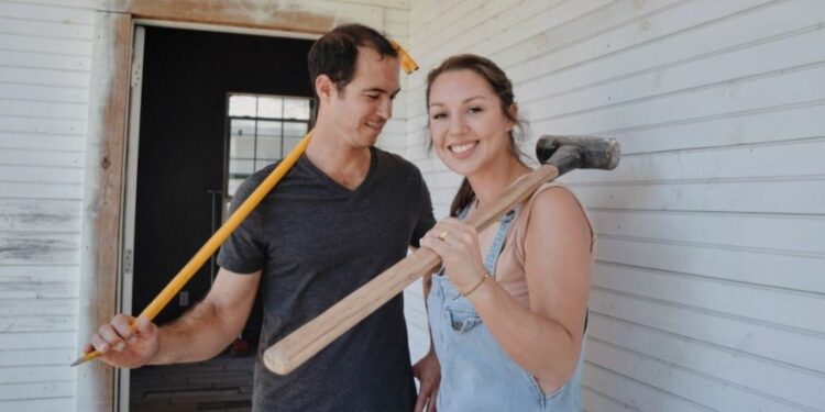 Michael COrdray holding hammer with his partner