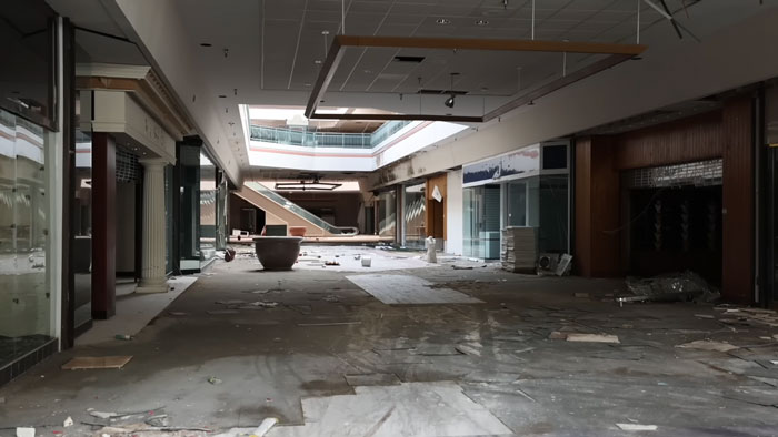 Influencers Exploring An Abandoned Mall Find A Dog Trapped Under An Escalator And Save The Day
